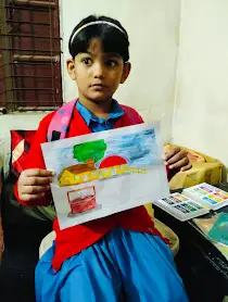 A young Child holding a colorful drawing paper